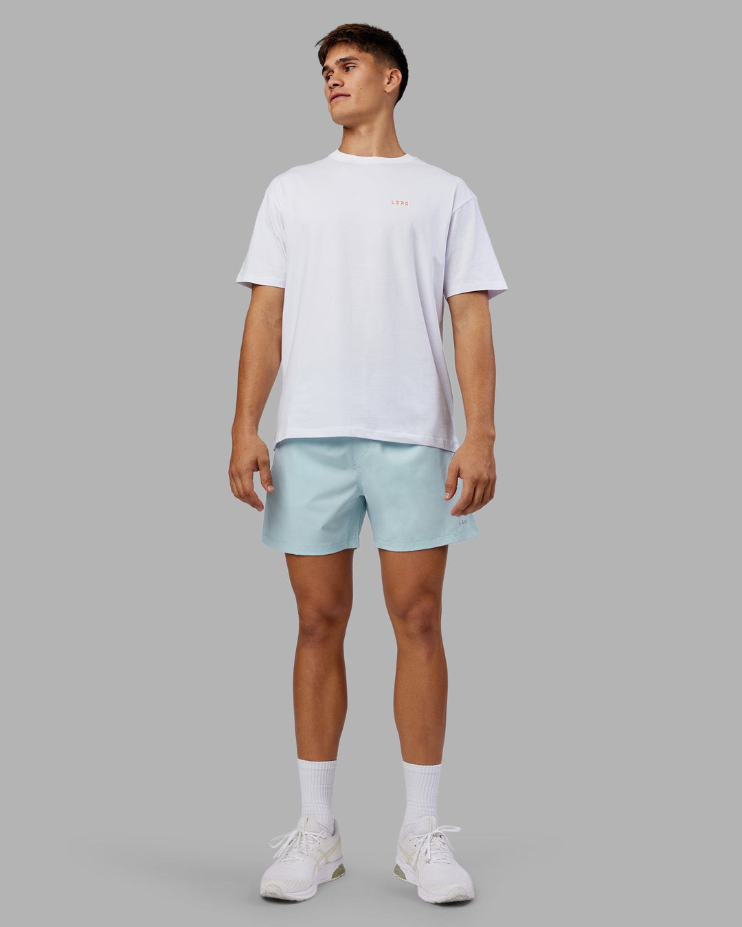 Man wearing Enjoy the Journey Value Series FLXCotton Tee Oversize - White-Vibrant Orange | Model:Jackson | Size:L