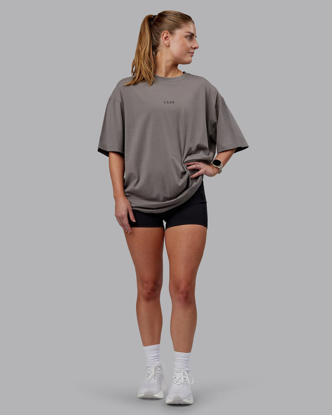 Woman wearing Unisex Leg It FLXCotton Tee Oversize - Storm Front-Black