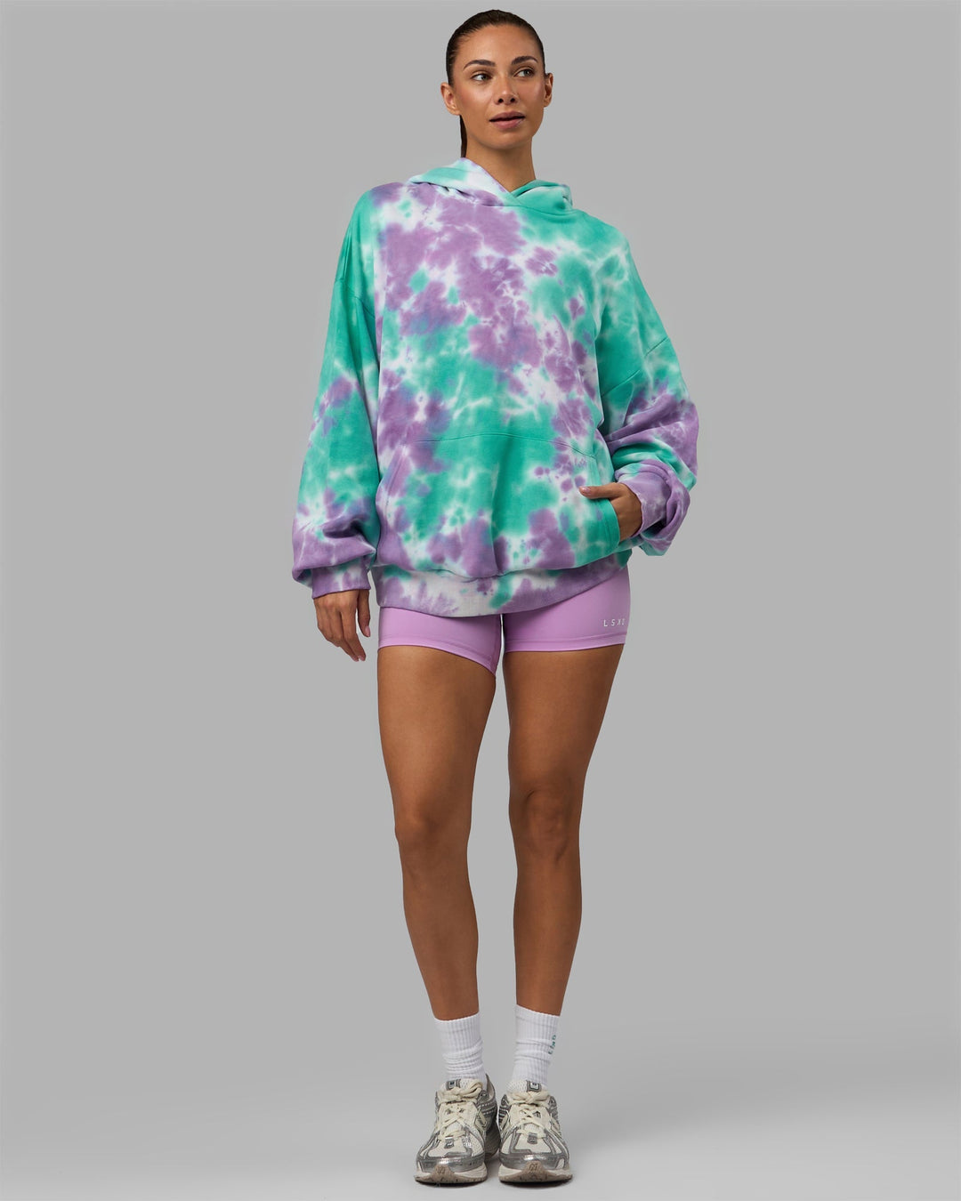 Woman wearing Unisex Lifting Club Hoodie Oversize - Cockatoo-Tie Dye