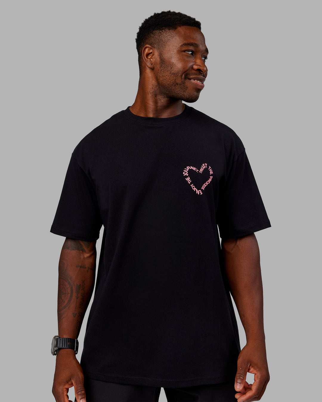 Man wearing Love The Process FLXCotton Oversize Tee - Black-Pink Lemonade | Model:Sam | Size:L