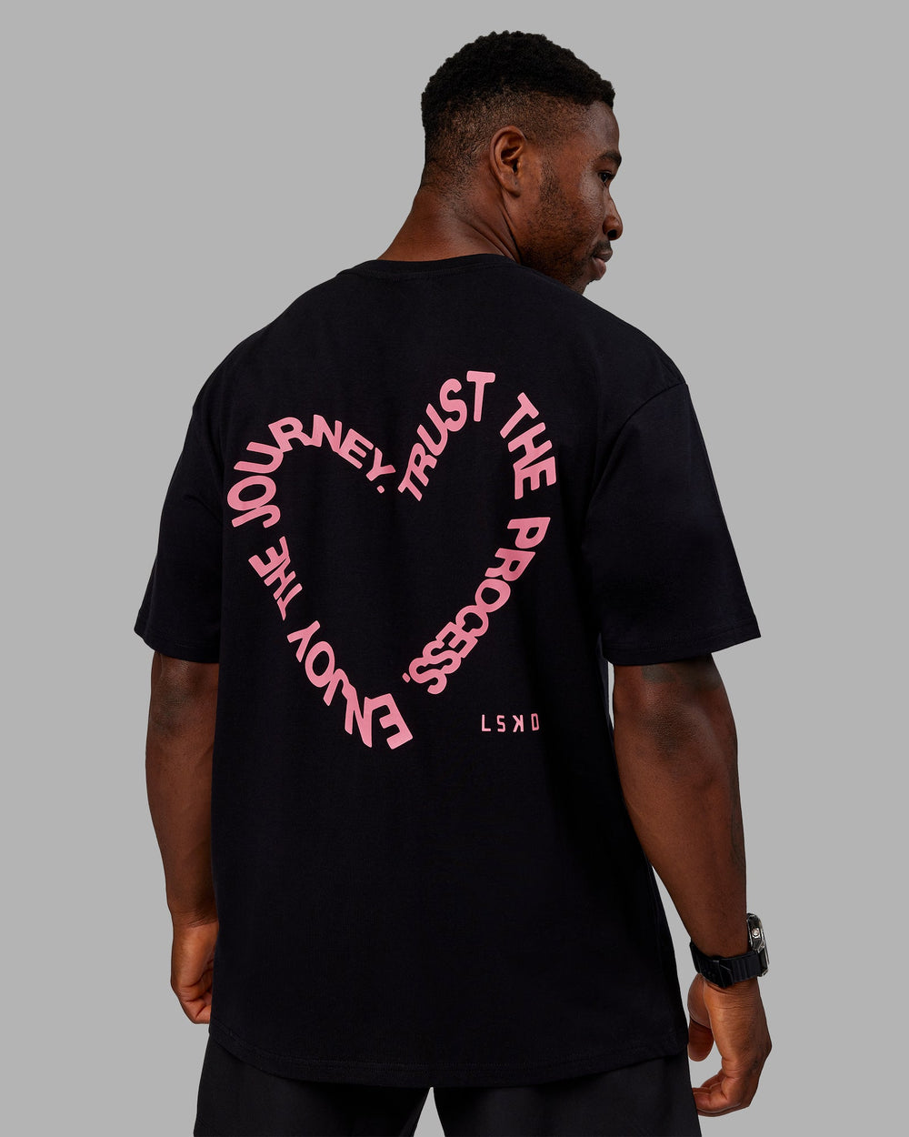 Man wearing Love The Process FLXCotton Oversize Tee - Black-Pink Lemonade | Model:Sam | Size:L