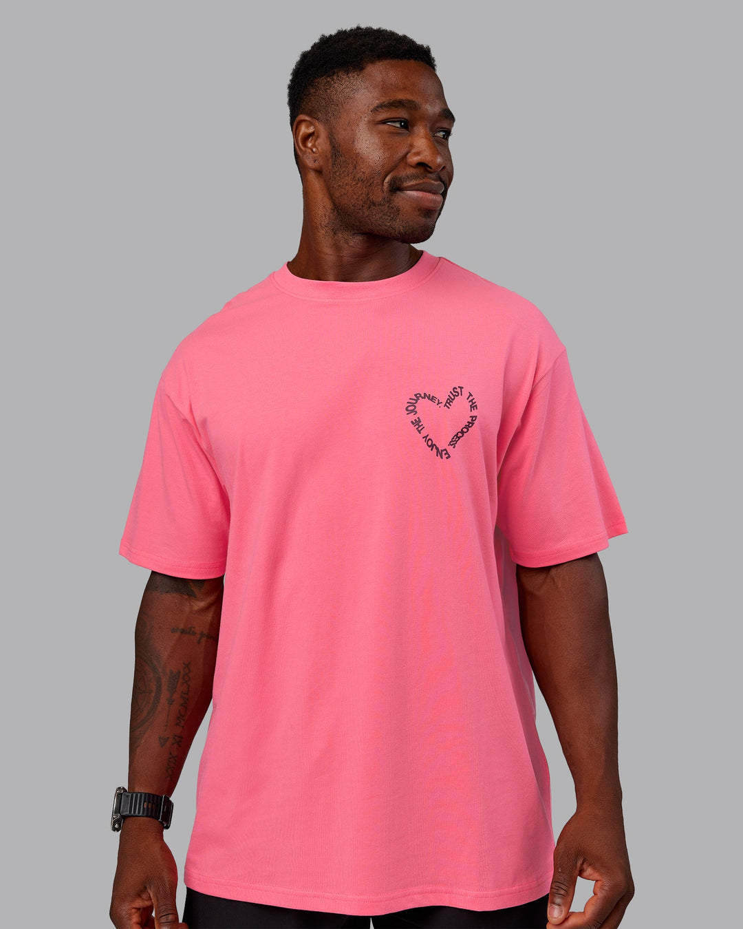 Man wearing Love The Process FLXCotton Oversize Tee - Pink Lemonade-Cherry Lacquer | Model:Sam | Size:L