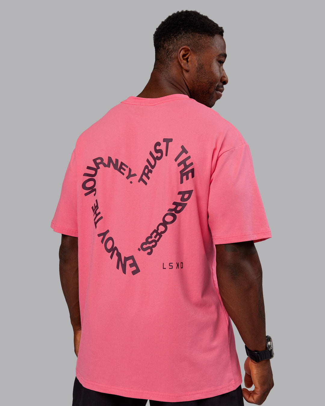 Man wearing Love The Process FLXCotton Oversize Tee - Pink Lemonade-Cherry Lacquer | Model:Sam | Size:L