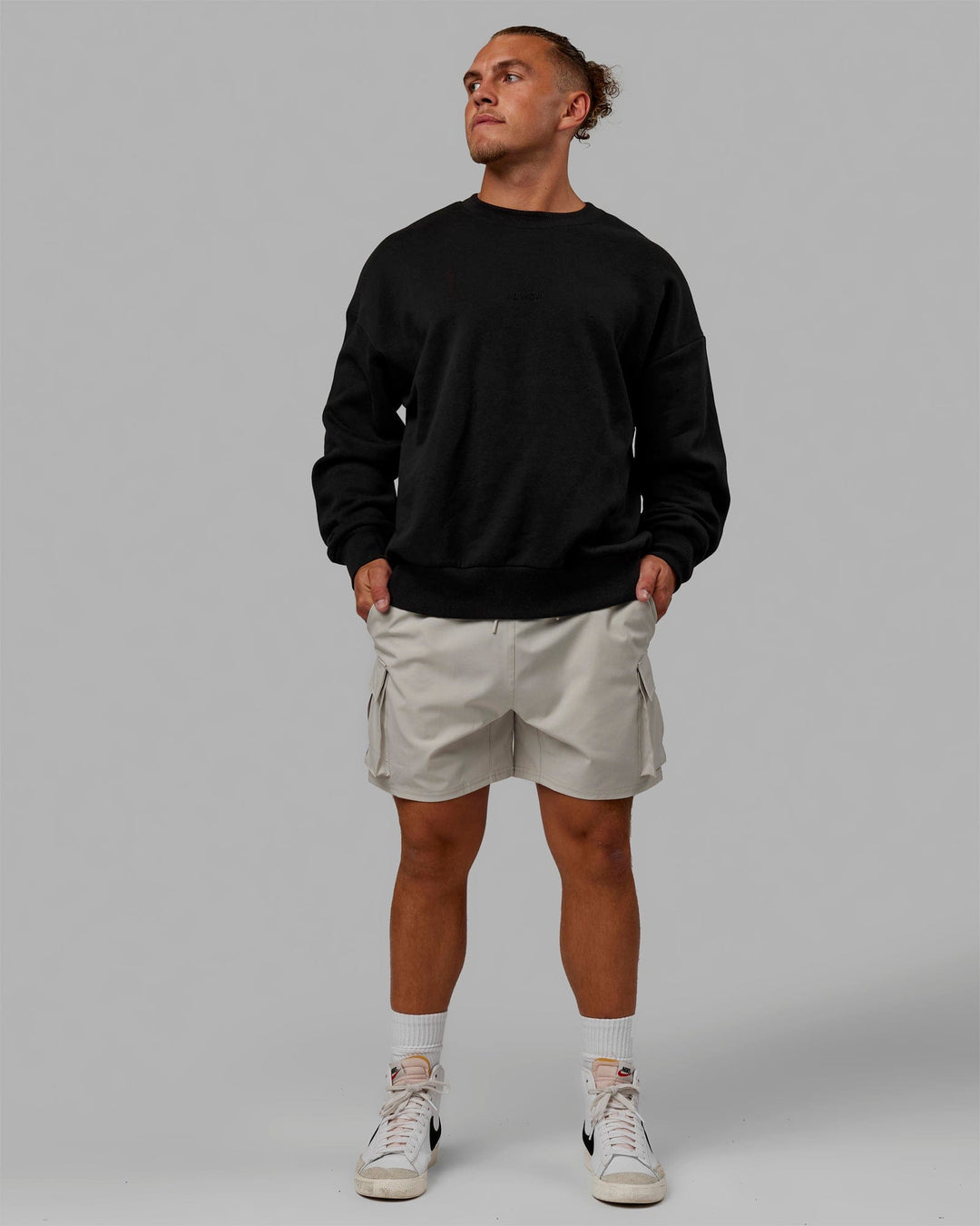 Man wearing Unisex MVP Sweater Oversize - Black