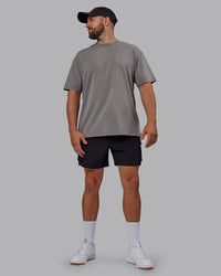 Man wearing Unisex Miami25 Washed FLXCotton Tee Oversize - Storm Front-Lemon Fizz