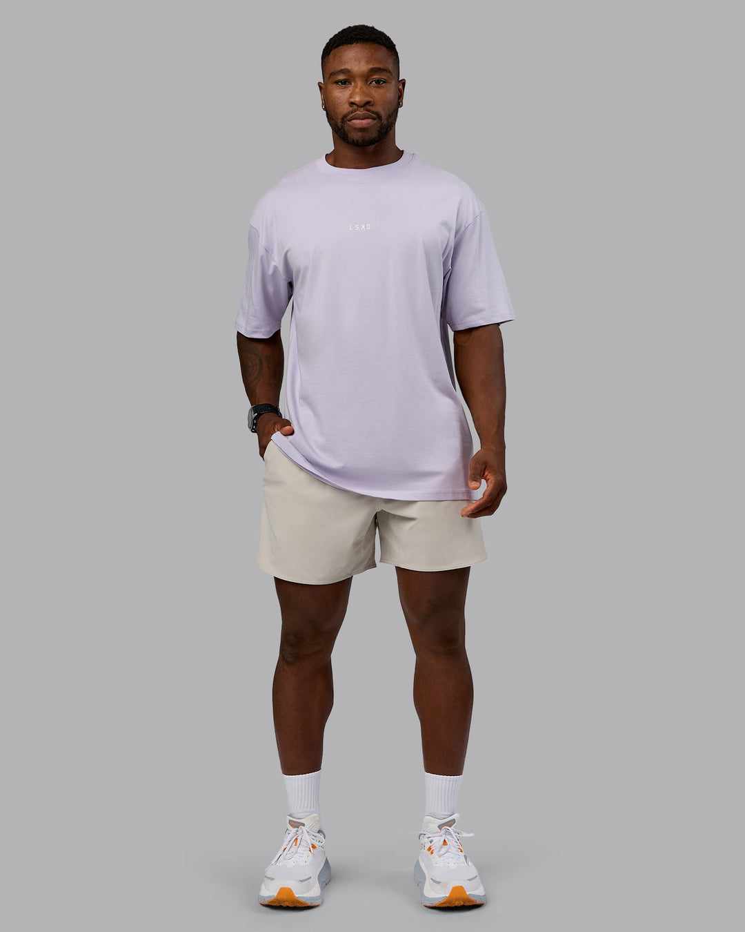 Man wearing On Repeat FLXCotton Oversized Tee - Galactic Lilac-Peach Fuzz | Model:Sam | Size:L