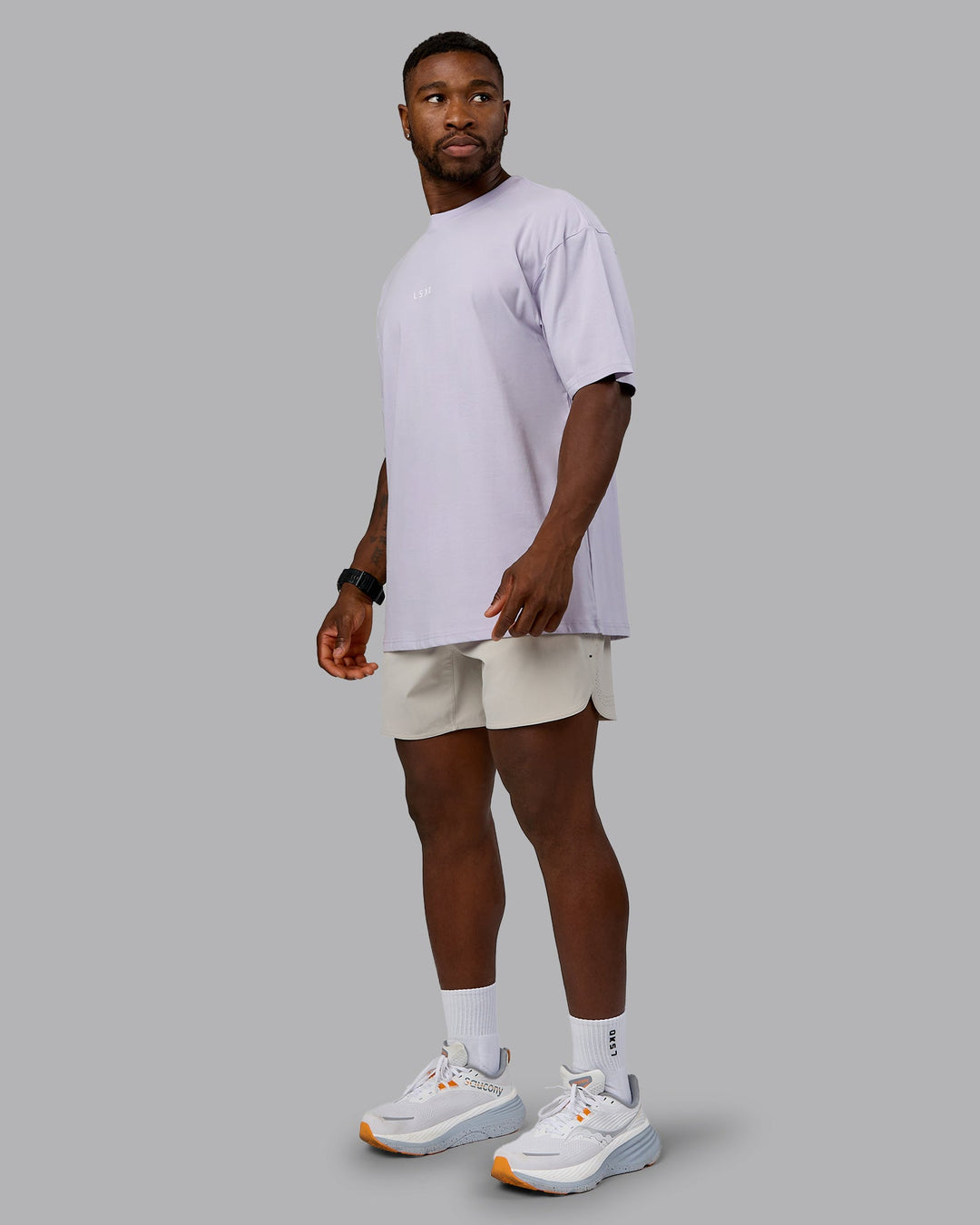 Man wearing On Repeat FLXCotton Oversized Tee - Galactic Lilac-Peach Fuzz | Model:Sam | Size:L