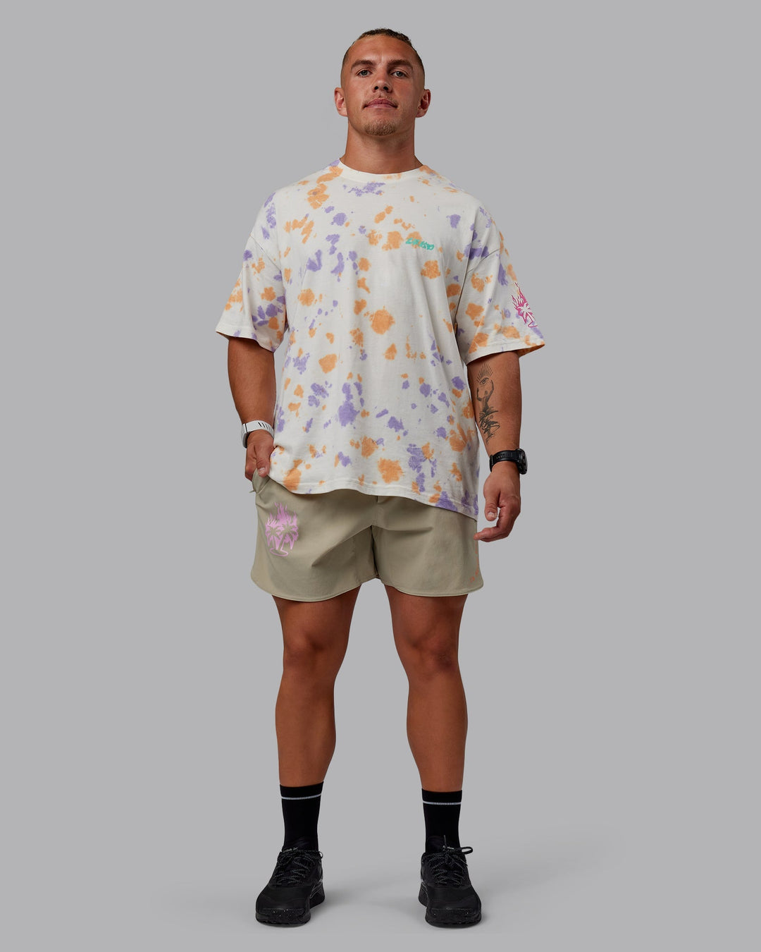 Man wearing Unisex Washed Huntington 24 Heavyweight Tee Oversize - Tie Dye Tangerine-Dahlia Purple