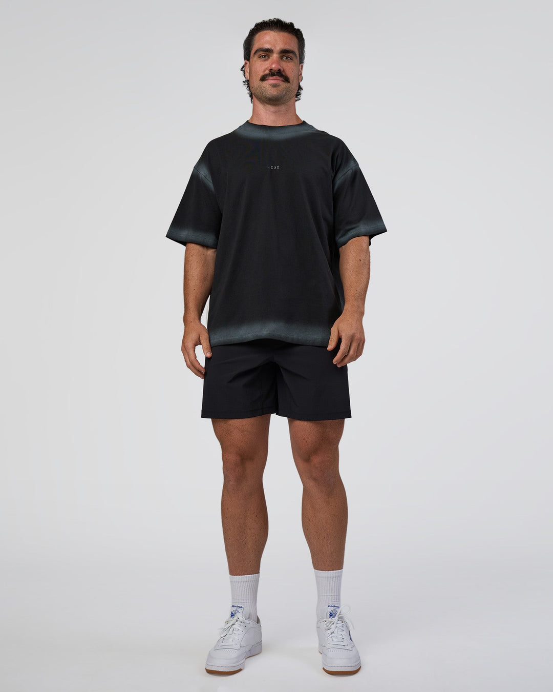 Man wearing Urban Blur Heavyweight Unisex Oversized Tee - Black-Dark Storm | Model:Adam | Size:L