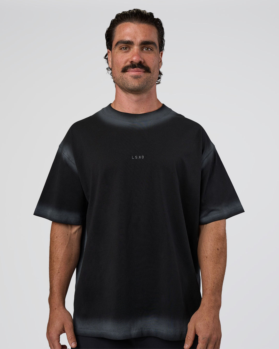 Man wearing Urban Blur Heavyweight Unisex Oversized Tee - Black-Dark Storm | Model:Adam | Size:L
