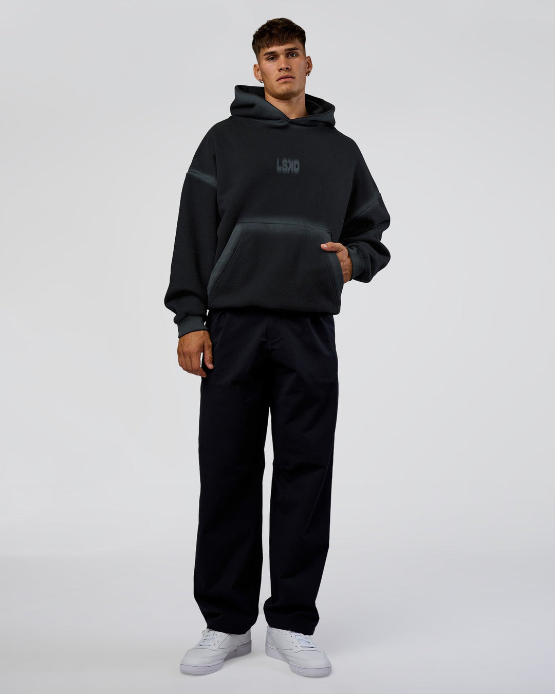 Man wearing Urban Blur Unisex Oversized Hoodie - Black-Dark Storm | Model:Jackson | Size:L