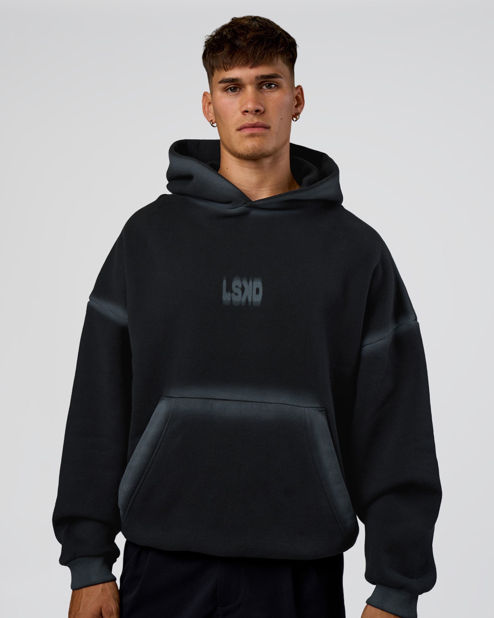 Man wearing Urban Blur Unisex Oversized Hoodie - Black-Dark Storm | Model:Jackson | Size:L