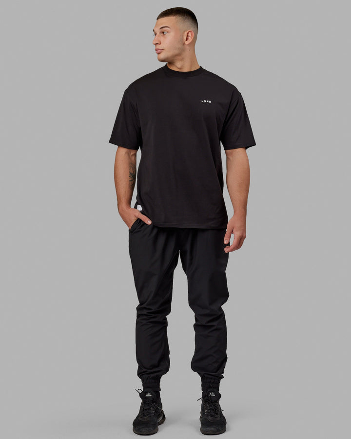Man wearing Unisex VS5 FLXCotton Tee Oversize - Black-White
