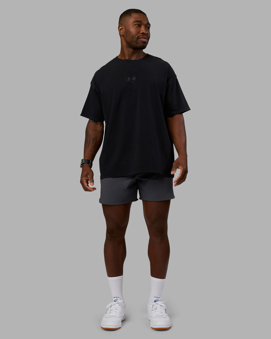 Man wearing Variation Heavyweight FLXCotton Oversized Tee - Black-Black | Model:Sam | Size:L