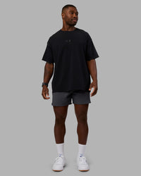 Man wearing Variation Heavyweight FLXCotton Oversized Tee - Black-Black | Model:Sam | Size:L