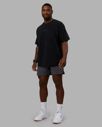 Man wearing Variation Heavyweight FLXCotton Oversized Tee - Black-Black | Model:Sam | Size:L