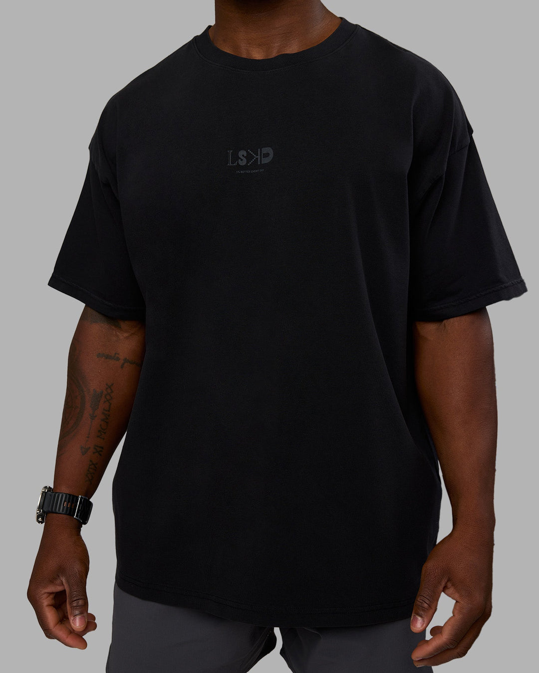 Man wearing Variation Heavyweight FLXCotton Oversized Tee - Black-Black | Model:Sam | Size:L