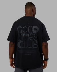Man wearing Variation Heavyweight FLXCotton Oversized Tee - Black-Black | Model:Sam | Size:L