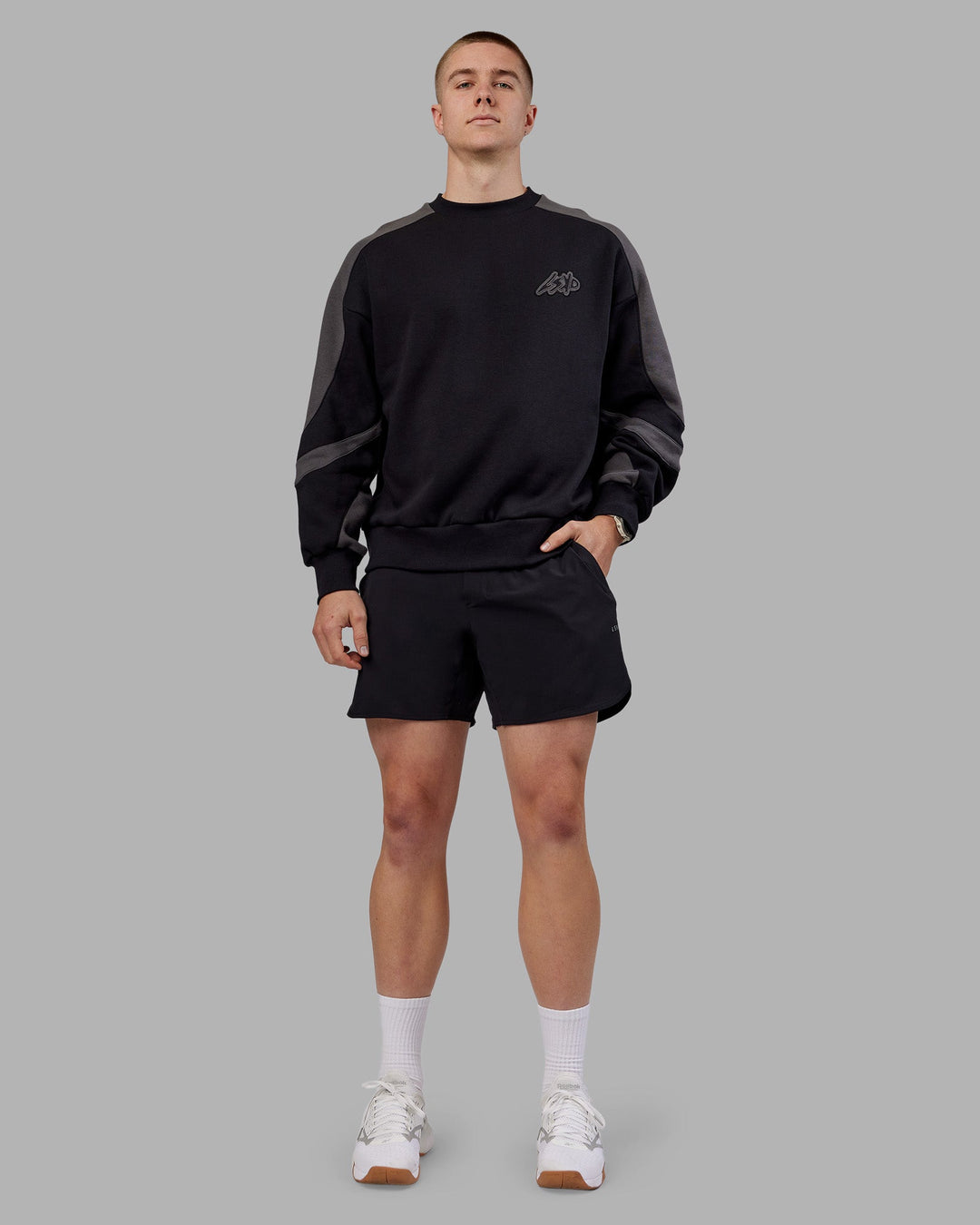 Man wearing Vibe Oversized Unisex Sweater - Black-Dark Storm | Model:Tom  Size:L