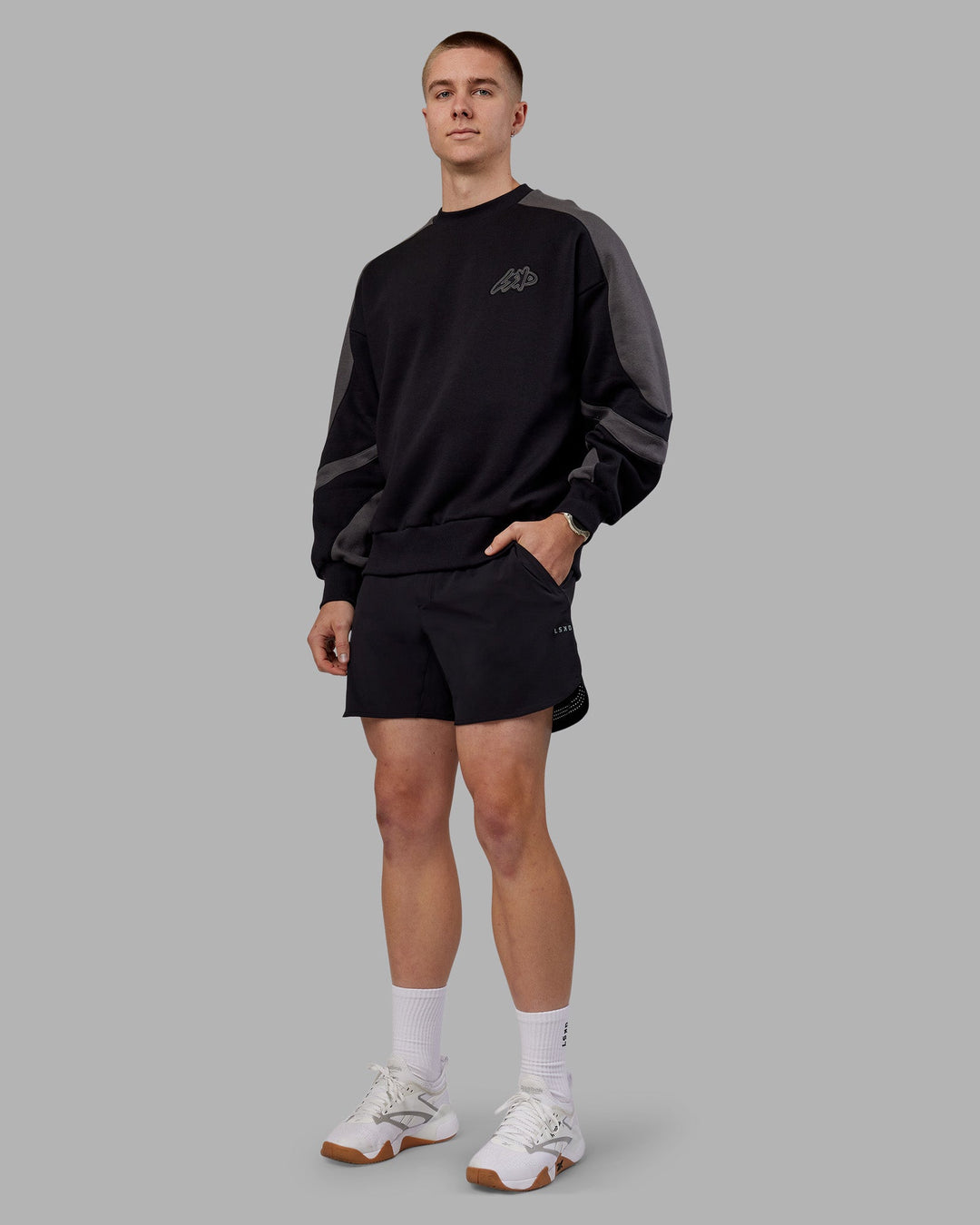Man wearing Vibe Oversized Unisex Sweater - Black-Dark Storm | Model:Tom  Size:L