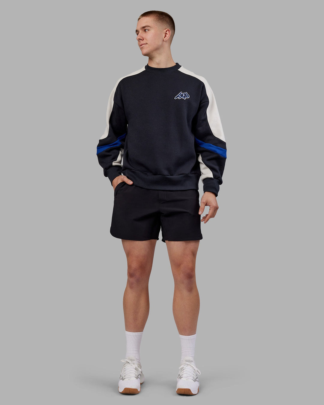 Man wearing Vibe Oversized Unisex Sweater - Caviar-Midnight Blue | Model:Tom | Size:L