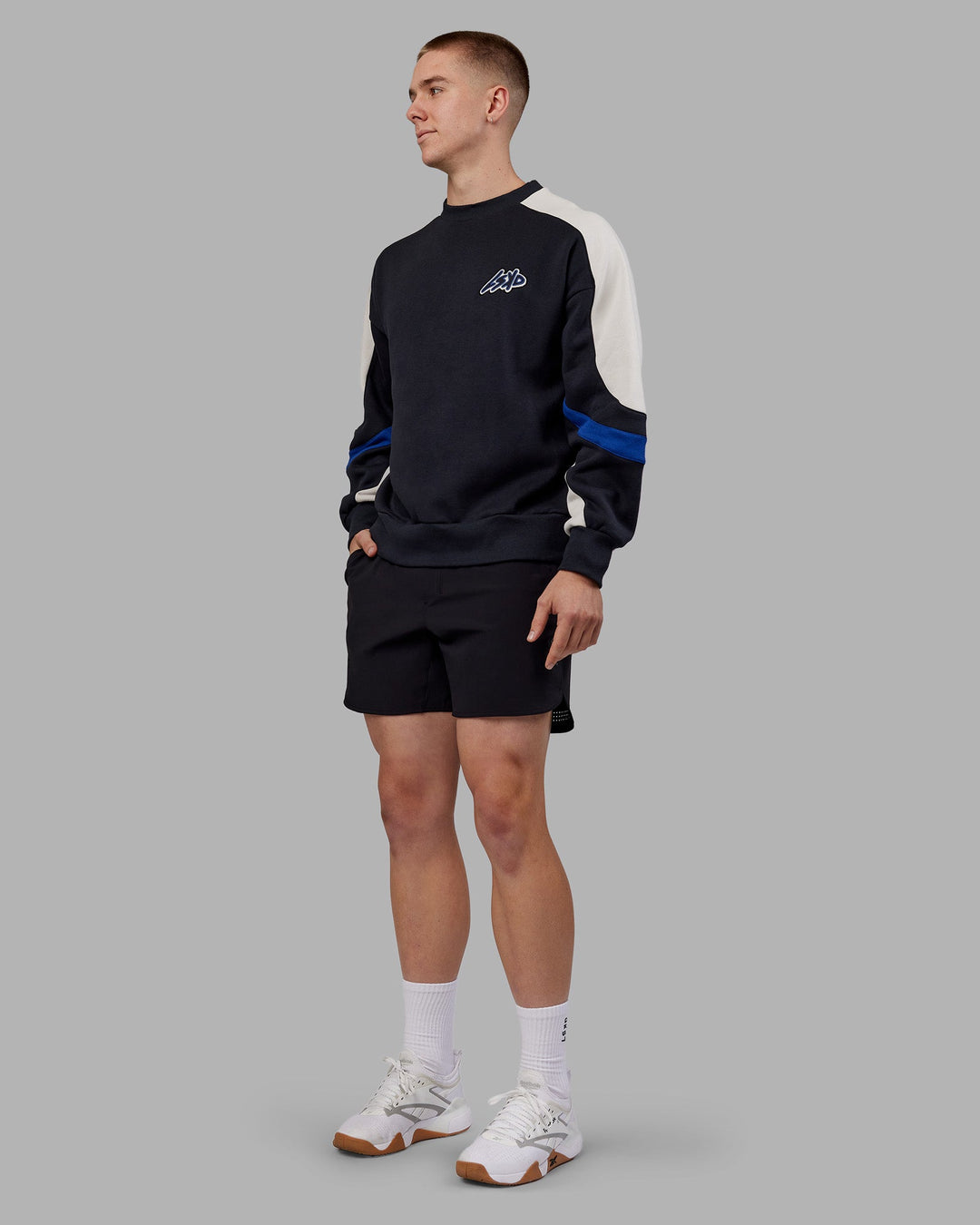 Man wearing Vibe Oversized Unisex Sweater - Caviar-Midnight Blue | Model:Tom | Size:L
