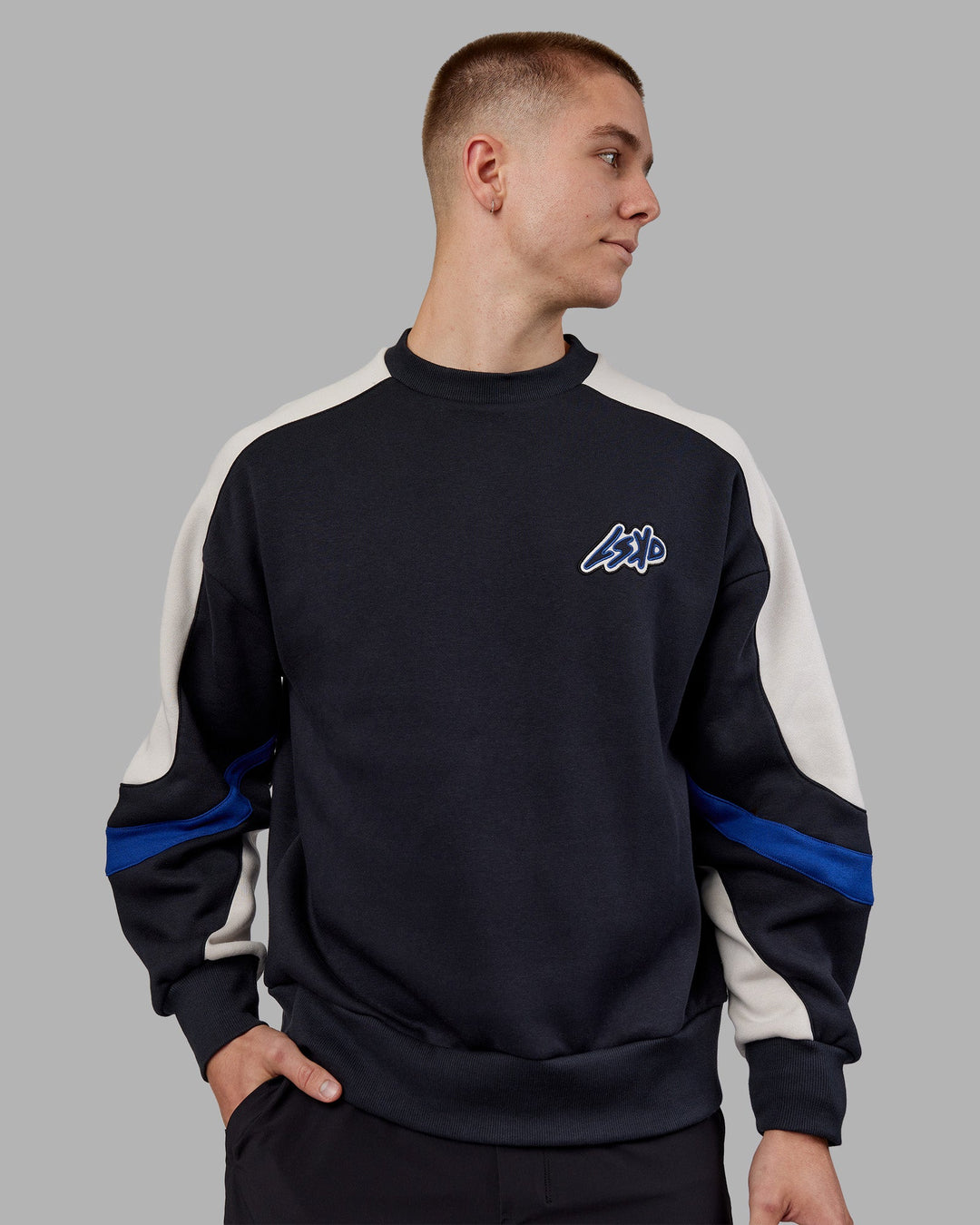 Man wearing Vibe Oversized Unisex Sweater - Caviar-Midnight Blue | Model:Tom | Size:L