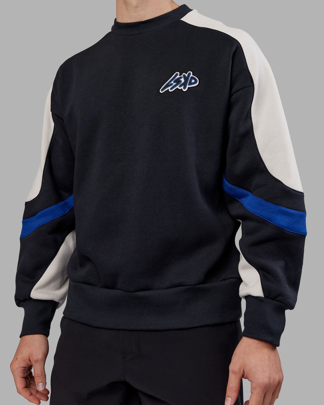 Man wearing Vibe Oversized Unisex Sweater - Caviar-Midnight Blue | Model:Tom | Size:L
