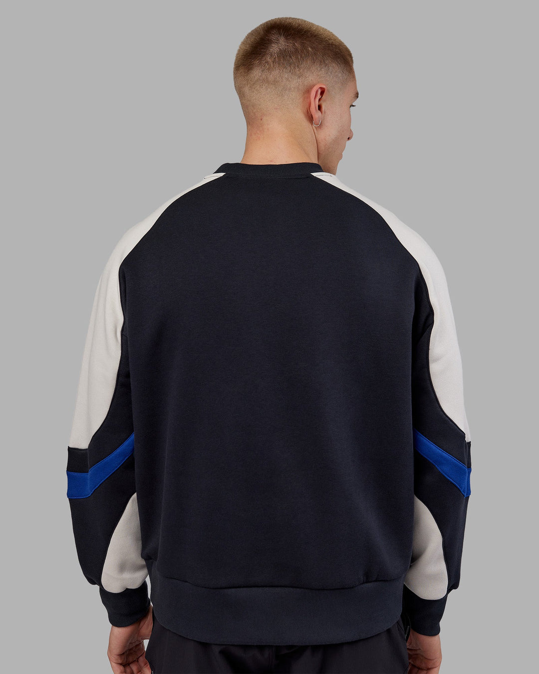 Man wearing Vibe Oversized Unisex Sweater - Caviar-Midnight Blue | Model:Tom | Size:L