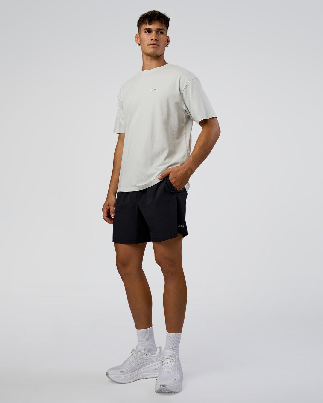 Man wearing We Love This  FLXCotton Oversized Tee - Digital Mist Washed-Electric Indigo | Model:Jackson | Size:L