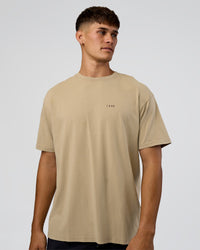 Man wearing We Love This  FLXCotton Oversized Tee - Greige Washed-Black | Model:Jackson | Size:L