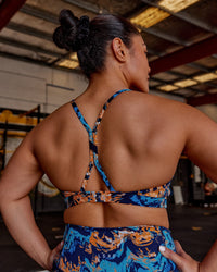 Woman wearing AMRAP High Neck Sports Bra - React Print | Model:Vana | Size:M | Thumbnail Index: 1