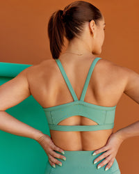 Woman wearing Abs Ignite Sports Bra - Matcha Green | Model:Abbey | Size:M