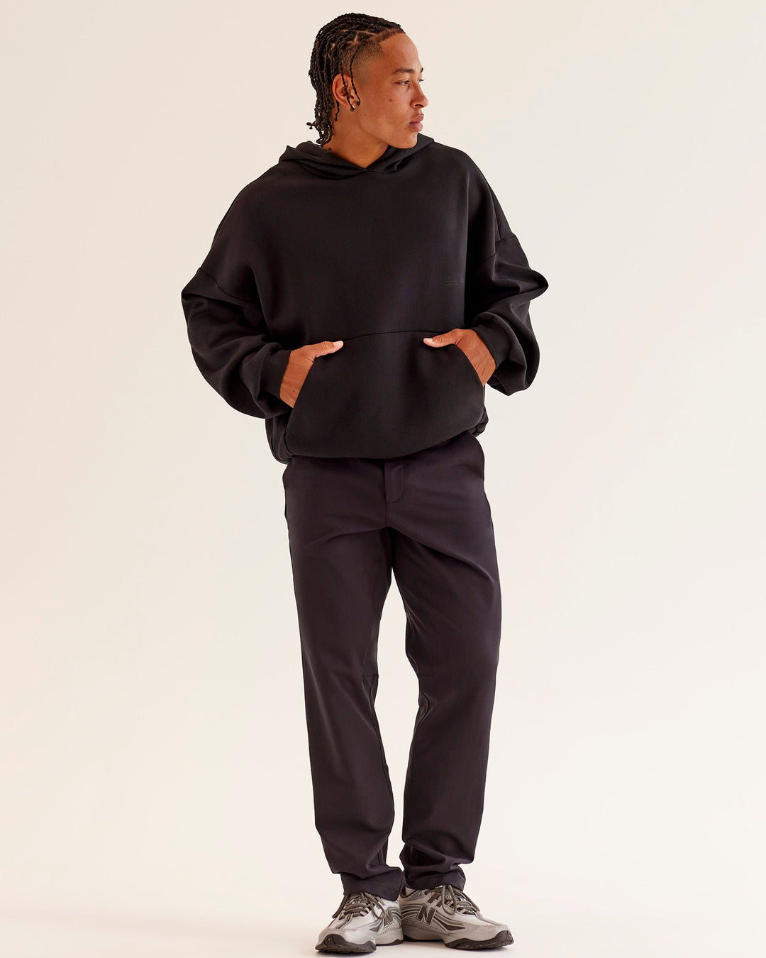 Woman wearing AfterDark ZeroCrease Oversized Hoodie - Black | Model:Loren | Size:XS