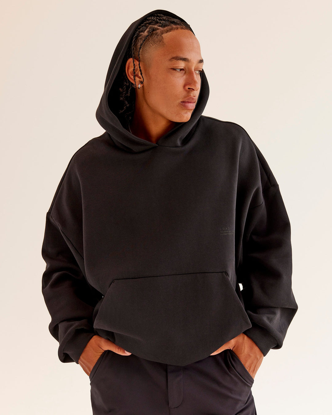 Man wearing AfterDark ZeroCrease Oversized Hoodie - Black | Model:Malebo | Size:M