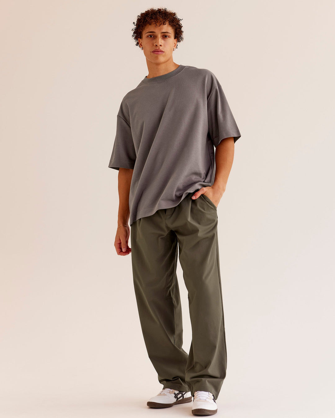Man wearing AfterDark ZeroCrease Oversized Tee - Duskstone | Model:Leandro | Size:M