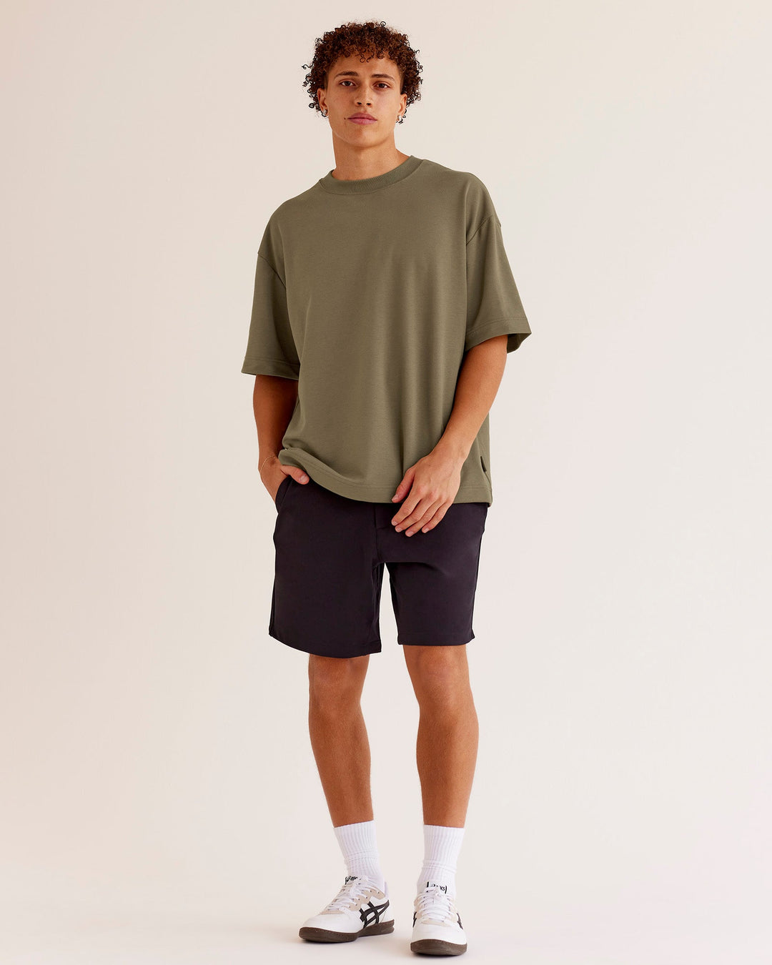 Man wearing AfterDark ZeroCrease Oversized Tee - Walnut Grey | Model:Leandro | Size:M
