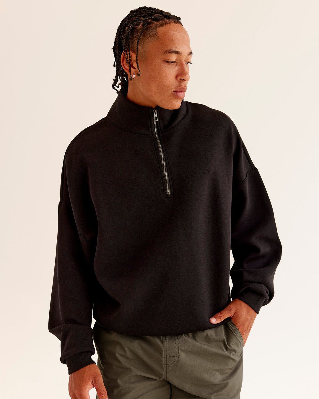 Man wearing AfterDark ZeroCrease Quarter Zip - Black | Model:Malebo | Size:M