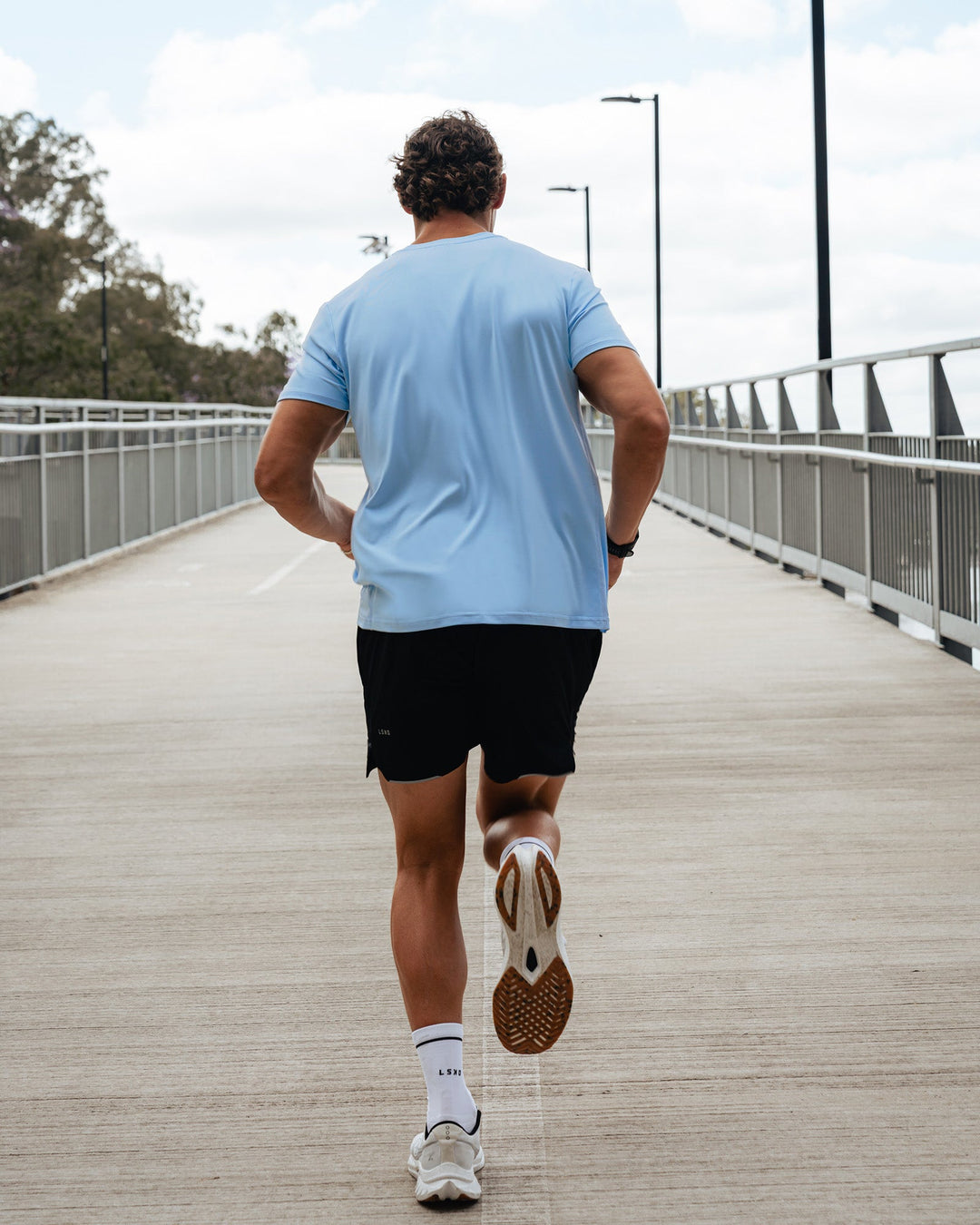 Man wearing AirTrack Tee - Open Air | Model:Julz | Size:M