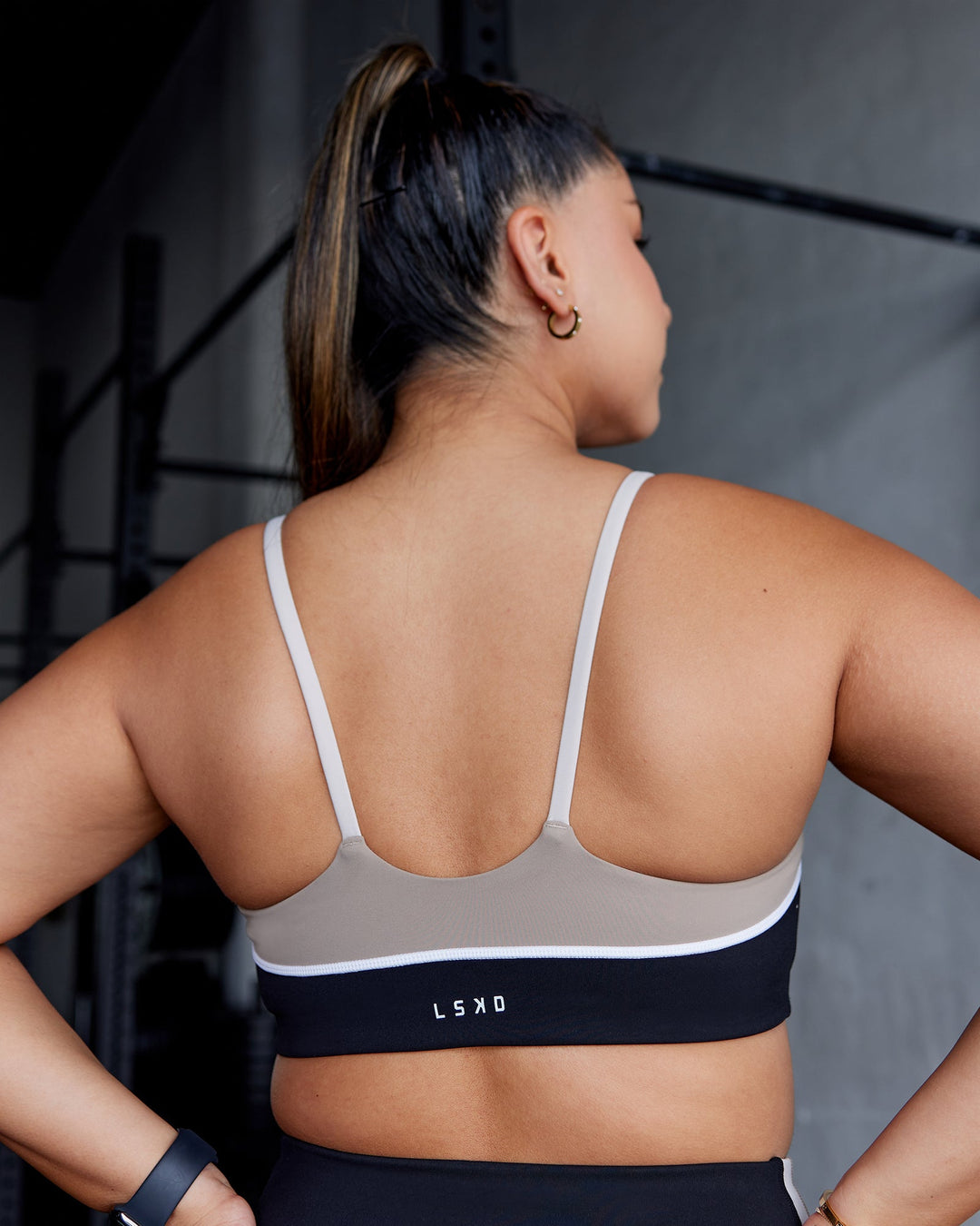 Woman wearing Embrace Sports Bra - Black-Multi| Model:Gloria | Size:M