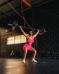 Woman wearing Fusion High-Rise 4" Short Pockets - Ultra Pink | Model:Tiare | Size:M