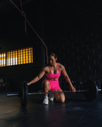 Woman wearing Fusion High-Rise 4" Short Pockets - Ultra Pink | Model:Tiare | Size:M