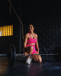 Woman wearing Fusion High-Rise 4" Short Pockets - Ultra Pink | Model:Tiare | Size:M