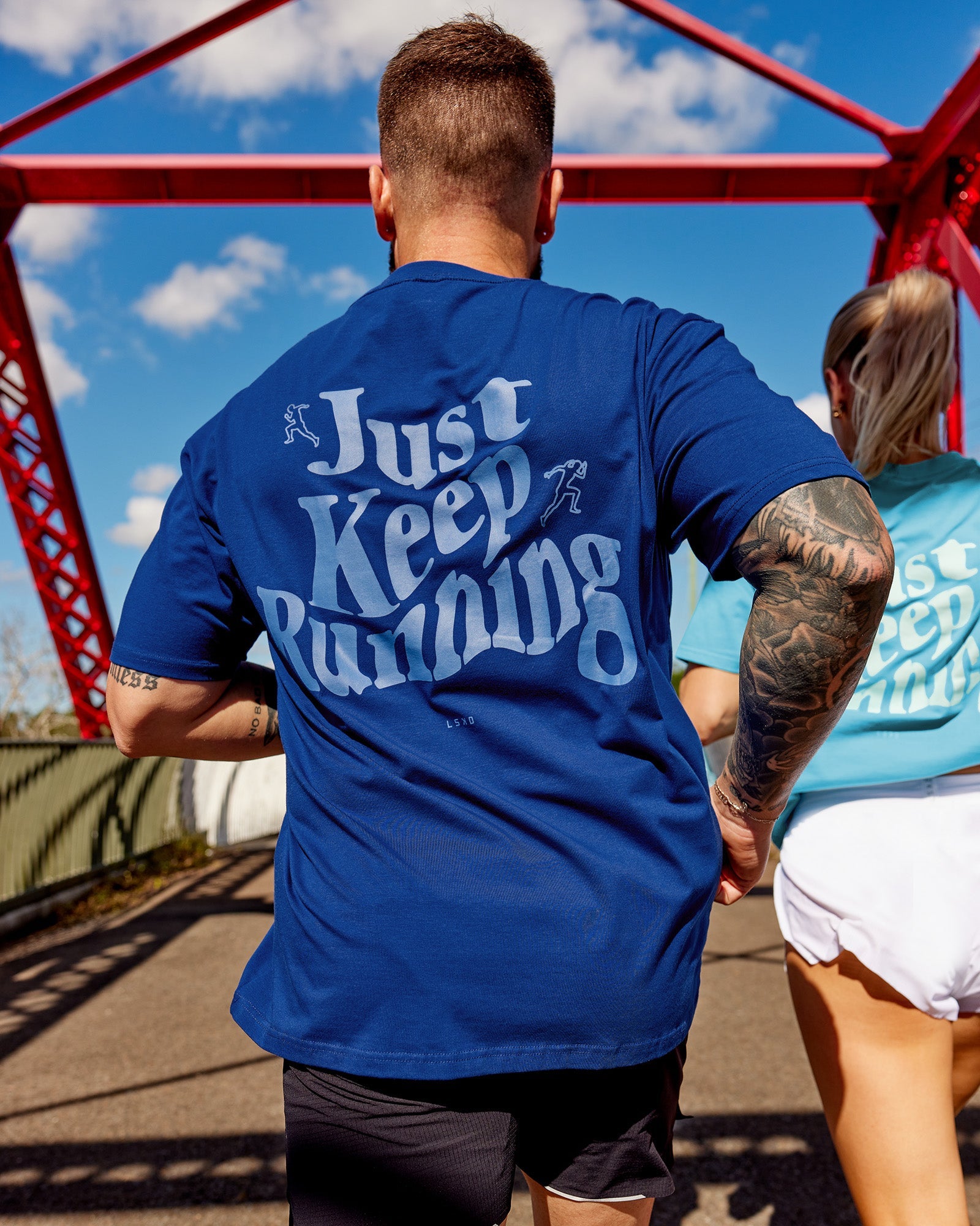 Man wearing Just Run FLXCotton Oversized Tee - Midnight Blue-Light Blue | Model:Macca | Size:M