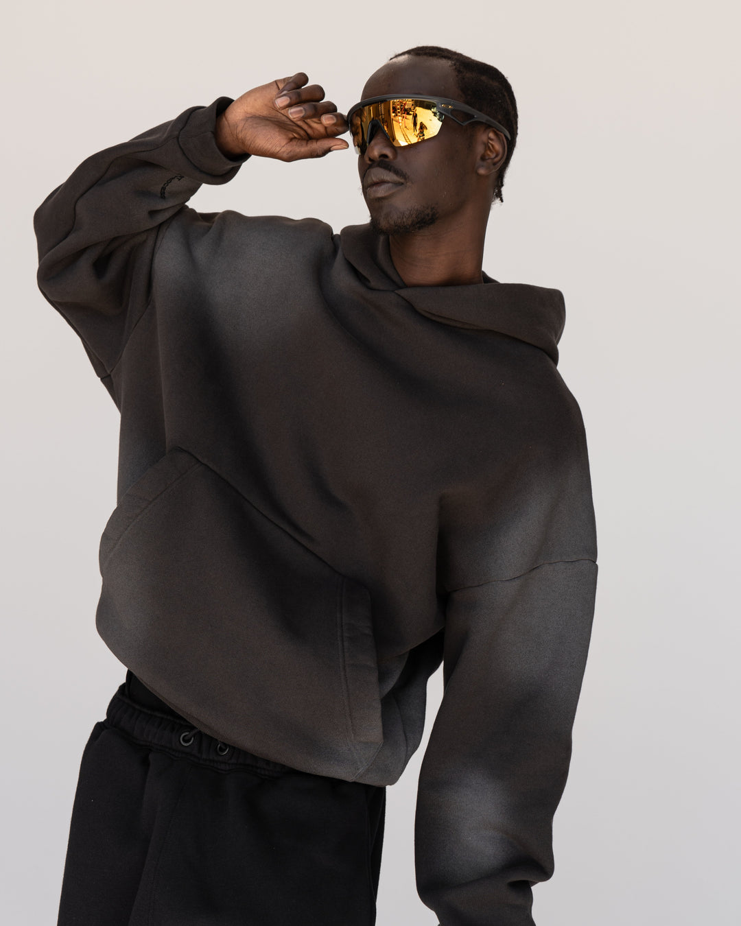 Man wearing Memory In Motion 500gsm Ultra Heavyweight Washed Hoodie - Charcoal Washed | Model:Okello | Size:M