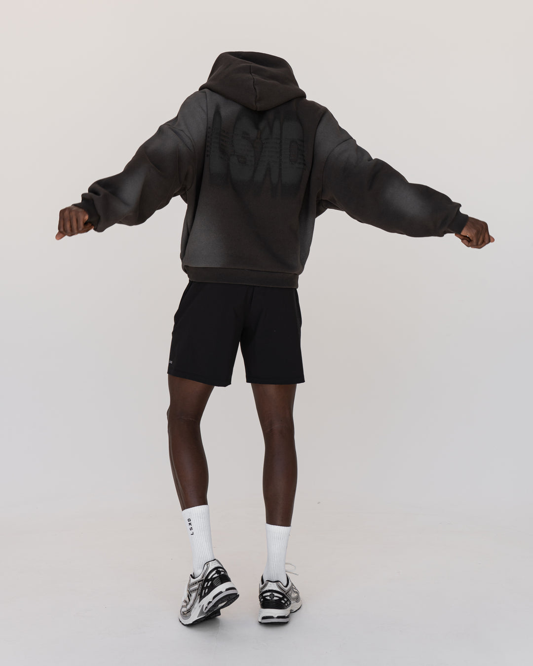 Man wearing Memory In Motion 500gsm Ultra Heavyweight Washed Hoodie - Charcoal Washed | Model:Okello | Size:M