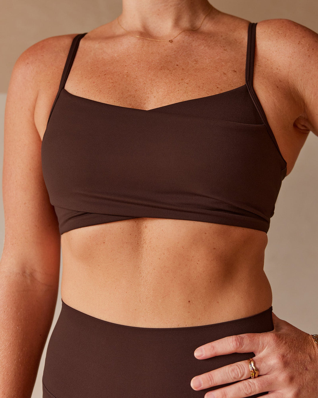 Woman wearing Peaches Wrap Sports Bra - Hot Chocolate | Model:Dani | Size:M - view 4