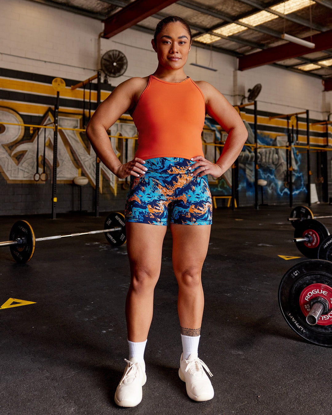 Woman wearing Power Performance Tank - Ultra Orange | Model:Vana | Size:M