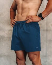 Man wearing Rep 5'' Performance Short - Night Sea | Model: | Size:M