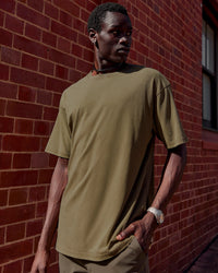 Man wearing Shadow Mode FLXCotton Oversized Tee - Walnut Grey Washed | Model:Mabyro | Size:M
